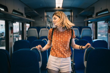 Fototapeta na wymiar Young woman in train