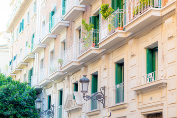 Facade of an ancient building with balconies and flowers