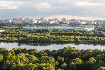 Fototapeta na wymiar MOSCOW, RUSSIA - June, 2017: Kapotnya, Moskva Reka, Maryno and Brateevo, outskirts of UVAO Moscow, Russia. Summer view of city, park and Moscow River. Evening