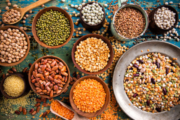 Raw legume on old rustic wooden table.