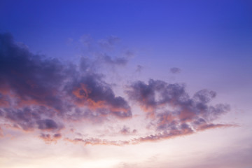 sunset / sun rise sky with rays of yellow and red light shining clouds and sky background and texture