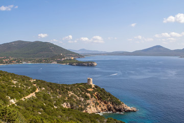 Small bay with Ruins of Ancient Watchtower in Sardinia