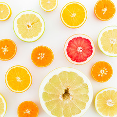 Citrus fruits on white background. Flat lay, top view. Fruit's background or pattern
