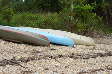 Kayaks on rocky beach 