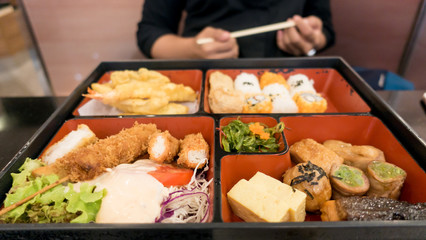 women eating  bento box set