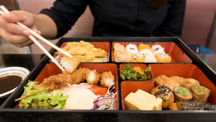 women eating  bento box set