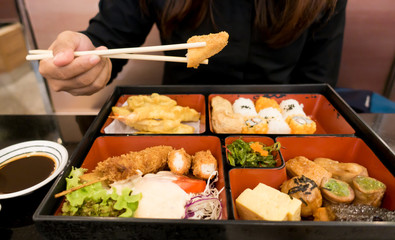 women eating  bento box set