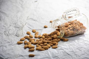 Almonds spilling out of the glass jar and its a long shot.