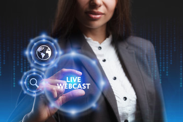 The concept of business, technology, the Internet and the network. A young entrepreneur working on a virtual screen of the future and sees the inscription: Live webcast