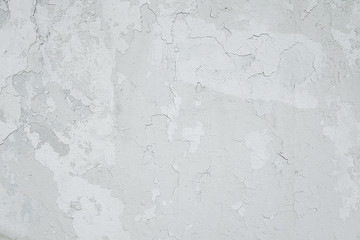Old white cracked painted wall background texture