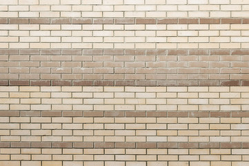 Old beige brick wall background texture