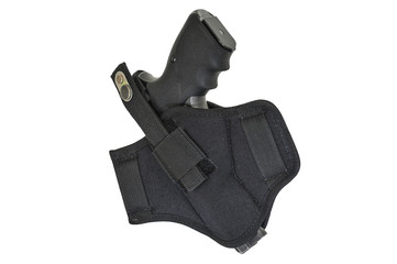 Handgun in the nylon holster. Isolated