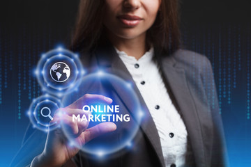 The concept of business, technology, the Internet and the network. A young entrepreneur working on a virtual screen of the future and sees the inscription: Online marketing