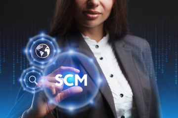 The concept of business, technology, the Internet and the network. A young entrepreneur working on a virtual screen of the future and sees the inscription: SCM