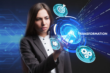 The concept of business, technology, the Internet and the network. A young entrepreneur working on a virtual screen of the future and sees the inscription: Transformation