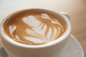 Cup of coffee with beautiful Latte art.how to make latte art coffee