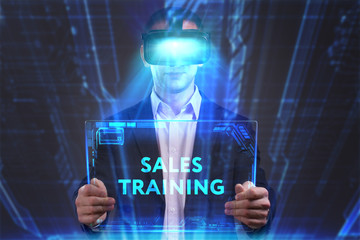 Business, Technology, Internet and network concept. Young businessman working in virtual reality glasses sees the inscription: Sales training