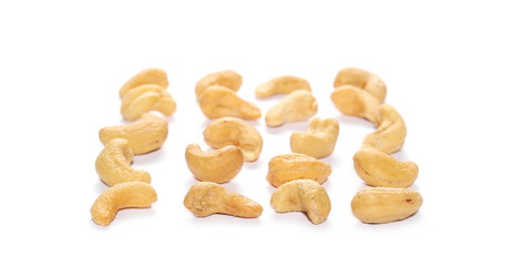 Fototapeta na wymiar Unshelled roasted and salted cashew nuts isolated on white background 