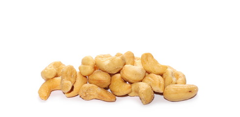 Unshelled roasted and salted cashew nuts isolated on white background
