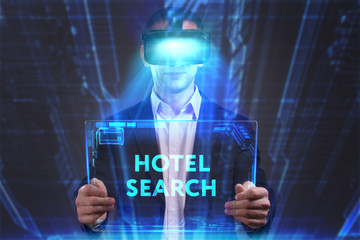 Business, Technology, Internet and network concept. Young businessman working in virtual reality glasses sees the inscription: Hotel search