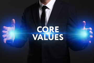 Business, Technology, Internet and network concept. Young businessman working on a virtual screen of the future and sees the inscription: Core values