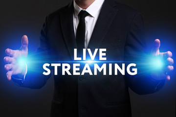 Business, Technology, Internet and network concept. Young businessman working on a virtual screen of the future and sees the inscription: Live streaming