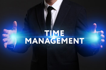 Business, Technology, Internet and network concept. Young businessman working on a virtual screen of the future and sees the inscription: Time management