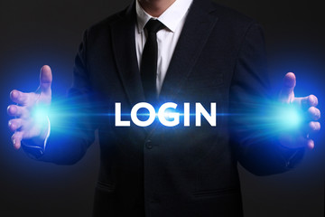 Business, Technology, Internet and network concept. Young businessman working on a virtual screen of the future and sees the inscription: Login