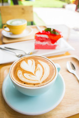coffee heart cup on wood table in coffe shop cafe