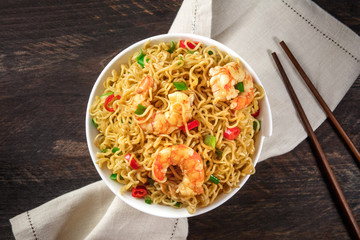 Instant noodles with vegetables and shrimps, plus copyspace