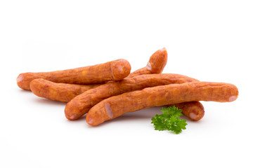 Stack of smoked sausages isolated on a white background.