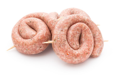 Raw sausages with herbs and spices.