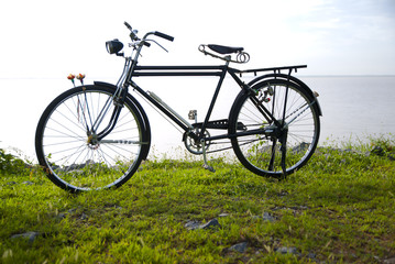 Naklejka na ściany i meble Old bike in Thailand, old bike in dam