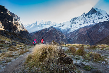 The traveler's walking on the way to Annapurna base camp