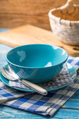 Bowls and plate with spoon.