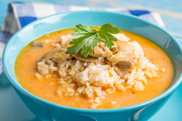 Tomato soup with rice.