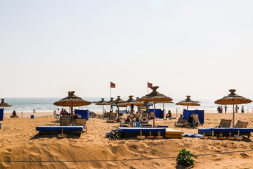 Fototapeta na wymiar Beach umbrellas on the sandy beach