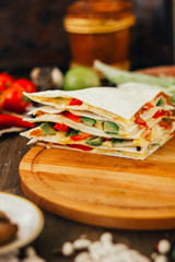 Nice vegetarian quesadilla with tortilla bread, beans, cheese and vegetables.