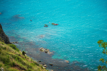 Colorful kayaks on the tropical beach on Milos island, Greece