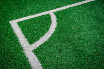 Fototapeta premium Corner(White stripe) on the green soccer field - background