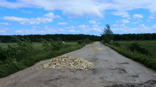 Very bad dirt road. Hole covered stone wild. Poor quality roads are specificity of poorest countries
