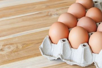 Fresh farm eggs on a wooden background
