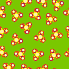 Red spinner with yellow circles, three blades.