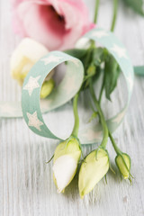 Eustoma flowers and star green ribbon