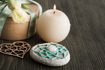 Gift box with star ribbon on dark rustic table