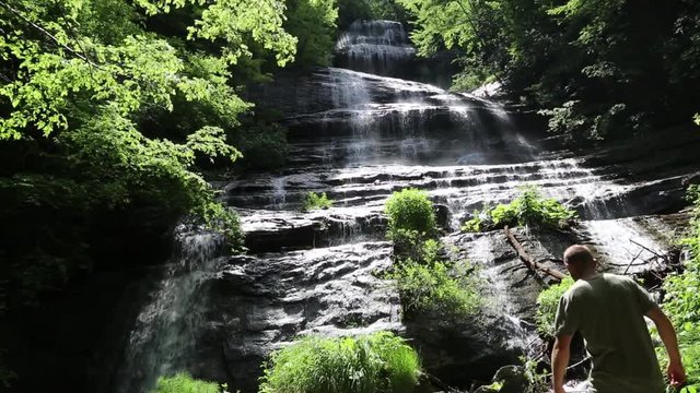 Hiker at the waterfall, Cascate della Prata