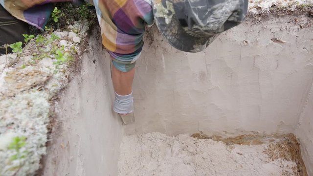 Stage of archaeological work - fine cleaning of the excavation wall