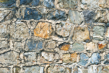 Ancient wall is made of stone background 