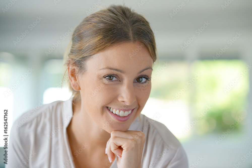 Wall mural Portrait of beautiful woman relaxing at home