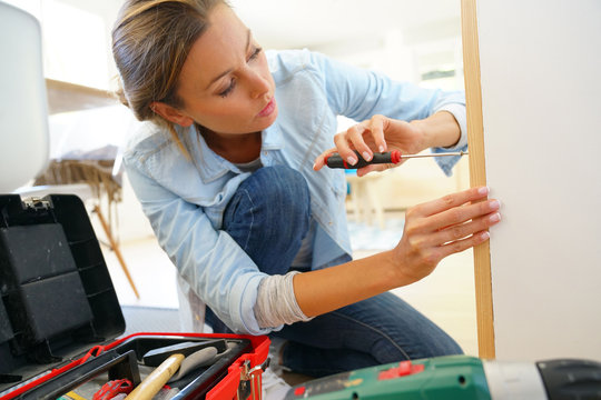 Woman doing DIY work at home